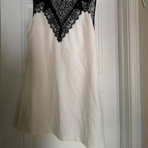 Lace top cream and black mini dress. Sizes 8 US/ Size 12 UK. It's cute